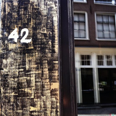 white hand written house number 42 in Amsterdam