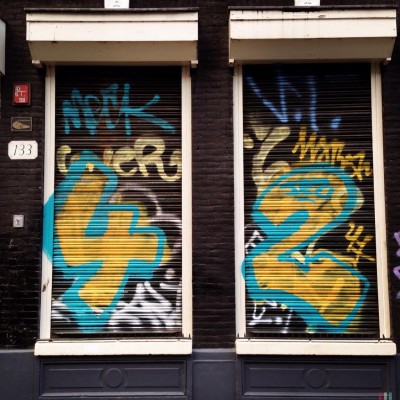 sprayed blue and yellow street number 42 in Amsterdam