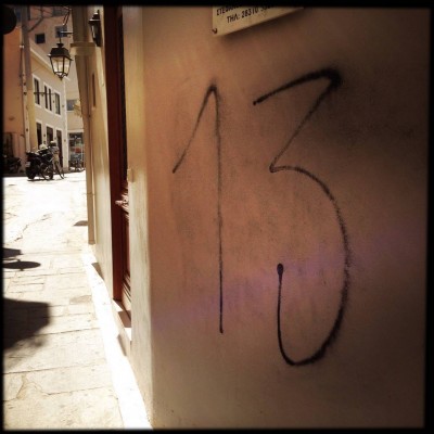 black hand written street number 13 on Crete