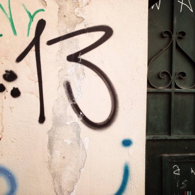 black hand written street number 13 in Athens