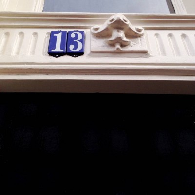 blue and white house number 13 in Amsterdam