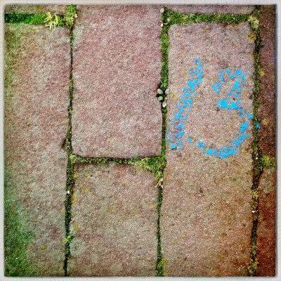 blue hand written with chalk street number 13 in Amsterdam