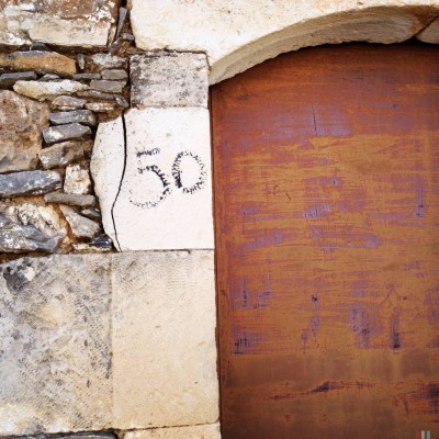 black hand written house number 50 on Crete