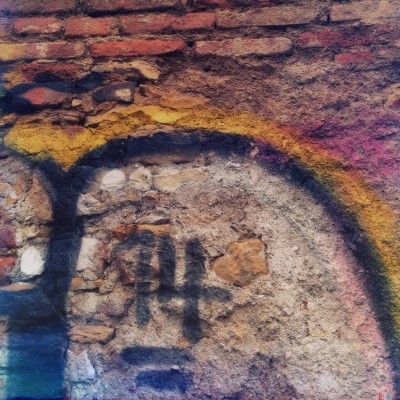 hand painted number 14 on a brick wall in Prague