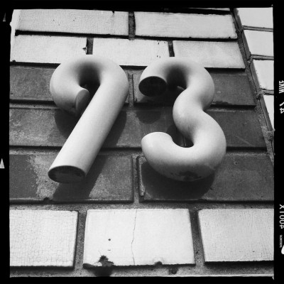 3D house number 93 on a brick wall in Amsterdam