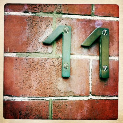 House number 11 on a brick wall in Amsterdam
